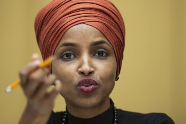 FILE - In this Sept. 24, 2019 file photo, Rep. Ilhan Omar, D-Minn., speaks on Capitol Hill in Washington. Omar has condemned State Sen. Oley Larsen, a Republican state senator from North Dakota who posted a long-debunked photo on his Facebook page that purports to show the Minnesota Democrat holding a weapon at an al-Qaida training camp. Larsen has since removed the photo.  Omar called the post "pure propaganda designed to stir up hate and violence." (AP Photo/Manuel Balce Ceneta File)