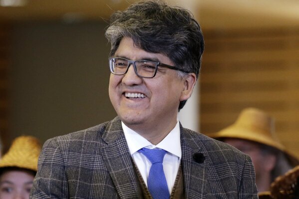 FILE - In this Oct. 10, 2016 file photo, author and filmmaker Sherman Alexie appears at a celebration of Indigenous Peoples' Day at Seattle's City Hall.  Alexie is included in a list of authors who wrote books that were among the 100 most subjected to censorship efforts over the past decade, as compiled by the American Library Association. Alexie's prize-winning “The Absolutely True Diary of a Part-Time Indian” came in at No. 1.  (AP Photo/Elaine Thompson, File)