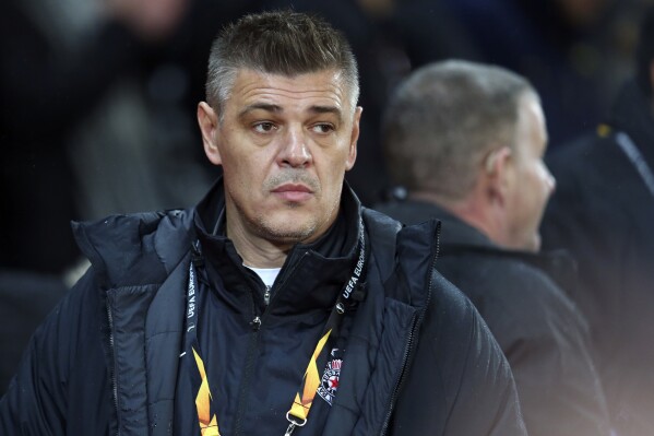 FILE - Savo Milosevic before the start of the Europa League group L soccer match between Manchester United and FK Partizan at Old Trafford Stadium in Manchester, England, on Nov. 7, 2019. Former Serbia forward Savo Milošević has been hired to coach the Bosnia-Herzegovina national team. He is its third different coach during qualifying for the 2024 European Championship. (AP Photo/Dave Thompson)