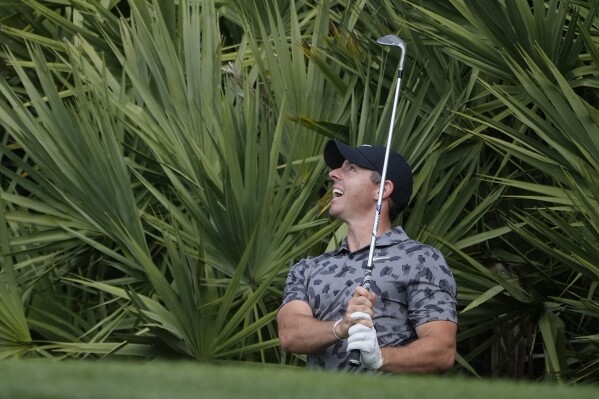 Rory McIlroy of Northern Ireland hits from the rough on the eighth green during the first round of the Cognizant Classic golf tournament, Thursday, Feb. 29, 2024, in Palm Beach Gardens, Fla. (AP Photo/Marta Lavandier)