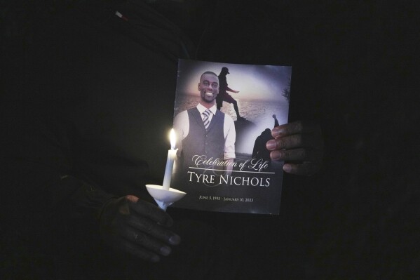 A crowd gathers to remember Tyre Nichols during a candlelight vigil on the anniversary of his death, Jan. 7, 2024, in Memphis, Tenn. The city of Memphis has released hours of more video in the case of five former police officers charged with the violent beating and death of Nichols. The recordings were released Tuesday, Jan. 30, 2024 based on a judge’s order on the same day last November that former officer Desmond Mills Jr. pleaded guilty to federal charges. (AP Photo/Karen Pulfer Focht)