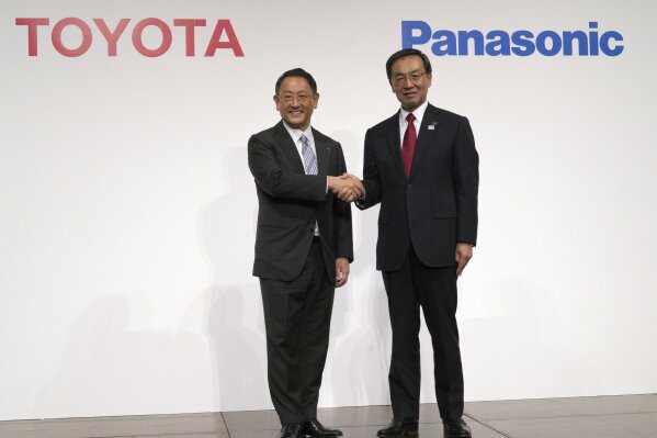 
              FILE - In this Dec. 13, 2017, file photo, Toyota Motor Corporation President Akio Toyoda, left, and Panasonic Corporation President Kazuhiro Tsuga, right, pose for photographers after a joint press conference in Tokyo. Toyota Motor Corp. and Panasonic Corp. said in a joint statement Tuesday, Jan. 22, 2019, they are setting up a joint venture to research, manufacture and sell batteries for ecological autos, an increasingly lucrative sector amid concerns about global warming. (AP Photo/Eugene Hoshiko, File)
            