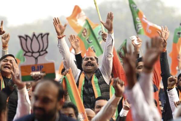 Supporters of Bharatiya Janata party shout slogans during Delhi state election campaign rally in New Delhi, India, Friday, Jan. 31, 2025. (AP Photo)