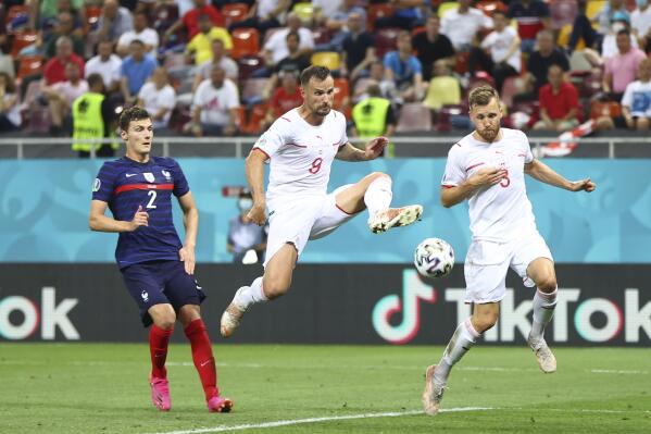 Switzerland's Haris Seferovic, center, misses a scoring chance during the Euro 2020 soccer championship round of 16 match between France and Switzerland at the National Arena stadium, in Bucharest, Romania, Monday, June 28, 2021. (Marko Djurica/Pool Photo via AP)