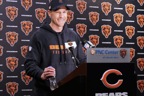 Chicago Bears new head coach Ben Johnson smiles as he talks to media members after the NFL football team's rookie camp in Lake Forest, Ill., Friday, May 9, 2025. (AP Photo/Nam Y. Huh)