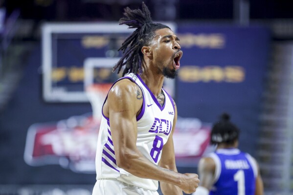 Grand Canyon guard Collin Moore (8) celebrates after a foul was called on Texas-Arlington during the first half of an NCAA college basketball game for the championship of the Western Athletic Conference men's tournament Saturday, March 16, 2024, in Las Vegas. (AP Photo/Ian Maule)