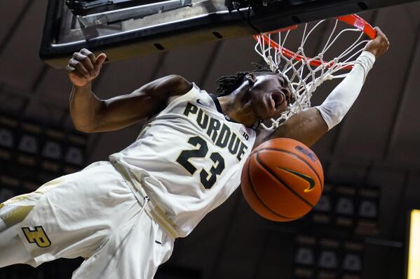 Purdue guard Jaden Ivey (23) reacts after a dunk against Iowa during the second half of an NCAA college basketball game in West Lafayette, Ind., Friday, Dec. 3, 2021. (AP Photo/Michael Conroy)