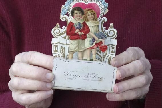 This image shows a Valentine’s Day card from 1917, given to Louise Wirt by Fred Roth when he was in the fourth grade. The couple married years later and the card remained near Louise's bedside until her death at 91. (Nancy Roth via AP)