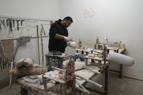 A man manufactures parts used for artificial limbs inside a room at the Artificial Limbs and Polio Center in Gaza City on Tuesday, Feb. 18. 2025. (AP Photo/Abdel Kareem Hana)