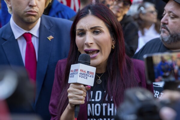 Right-wing activist Laura Loomer speaks in front of the courthouse where the hush-money trial of Donald Trump is underway, April 15, 2024, in New York. (AP Photo/Ted Shaffrey, File)