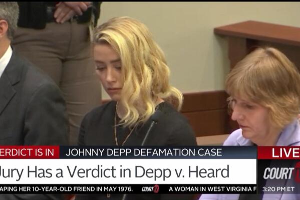 In this screen grab from video, Amber Heard reacts, with her lawyer Elaine Bredehoft at right, as the verdict is read in the courtroom in the Fairfax County Circuit Courthouse in Fairfax, Va., Wednesday, June 1, 2022. Actor Johnny Depp sued his ex-wife Heard for libel in Fairfax County Circuit Court after she wrote an op-ed piece in The Washington Post in 2018 referring to herself as a "public figure representing domestic abuse."(Court TV, via AP, Pool)