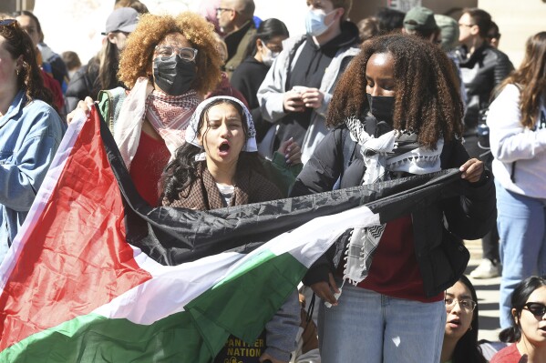 Several hundred students and pro-Palestinian supporters rally at the intersection of Grove and College Streets, in front of Woolsey Hall on the campus of Yale University in New Haven, Conn. April 22, 2024. (Ned Gerard/Hearst Connecticut Media via AP)