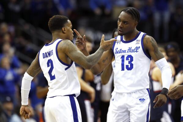 Seton Hall guard Al-Amir Dawes (2) and forward KC Ndefo (13) react after a Seton Hall score against UConn during the second half of an NCAA college basketball game in Newark, N.J., Wednesday, Jan. 18, 2023. Seton Hall won 67-66. (AP Photo/Noah K. Murray)