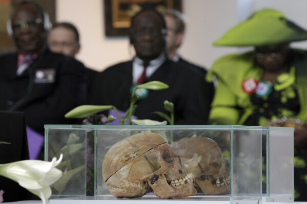 Skulls of people from the Ovaherero and Nama tribes, which were taken by German colonial forces more than a century ago for racial experiments, are returned to Namibian tribal leaders during a ceremony on Sept. 29, 2011, in Berlin, Germany. (AP Photo/Michael Sohn, File)