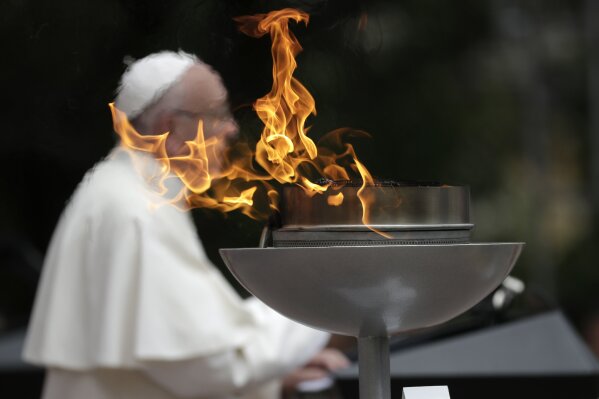 A "reconciliation flame" burns as Pope Francis speaks during a ceremony at the presidential palace in Bogota, Colombia, Thursday, Sept. 7, 2017. Pope Francis opens the first full day in his Colombia visit on Thursday with messages to political leaders and citizens alike encouraging all to rally behind a peace process seeking an end for Latin America's longest-running conflict and to address the inequalities that fueled it. (AP Photo/Andrew Medichini)