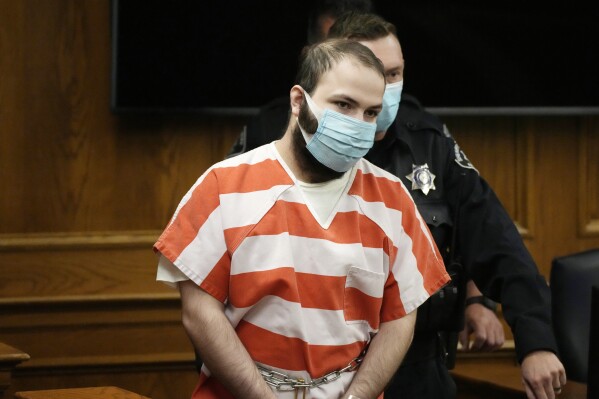 FILE - Ahmad Al Aliwi Alissa is led into a courtroom for a hearing, Sept. 7, 2021, in Boulder, Colo. Prosecutors said Wednesday, Aug. 23, 2023, that Alissa, accused of killing 10 people at a Boulder supermarket in 2021, is competent for trial. (AP Photo/David Zalubowski, Pool, File)