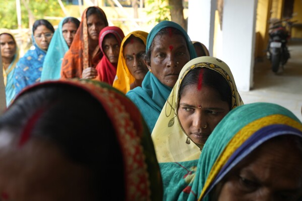 Women stand in a queue to cast their votes during the fourth phase of general election, on the outskirts of Samastipur, in the Indian state of Bihar, Monday, May 13, 2024. (AP Photo/Manish Swarup)