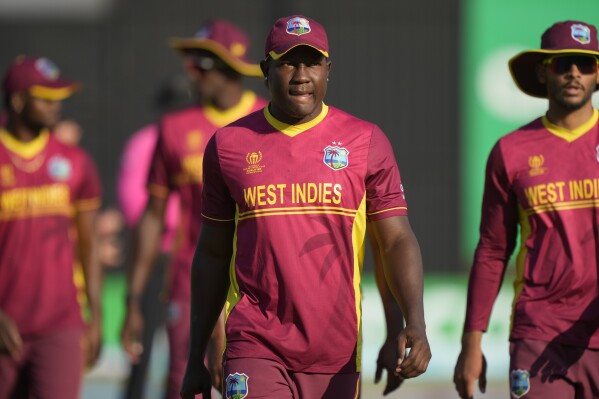 West Indies player Rovman Powell walks off the pitch after losing to Scotland in their ICC Men's Cricket World Cup Qualifier match at Harare Sports Club in Harare, Zimbabwe,Saturday July 1, 2023. (AP Photo/Tsvangirayi Mukwazhi)