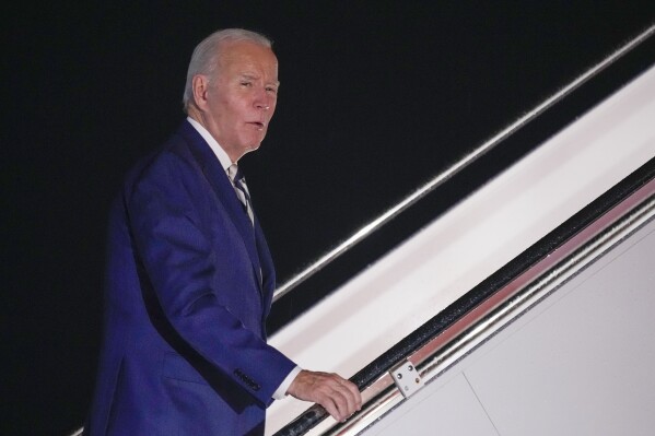 President Joe Biden answers a questions as he boards Air Force One at Andrews Air Force Base, Md., Friday, Oct. 20, 2023, to travel to Rehoboth Beach, Del. (AP Photo/Andrew Harnik)