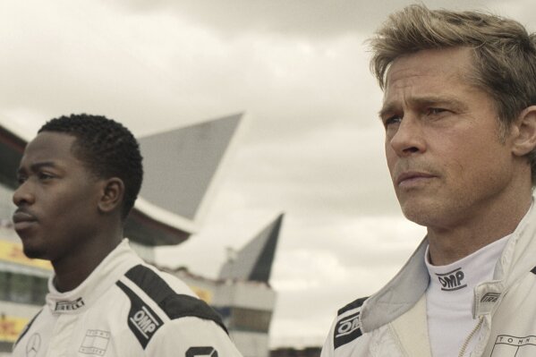 This image released by Apple TV+ shows Damson Idris as Joshua Pearce, left, and Brad Pitt as Sonny Hayes in a scene from 