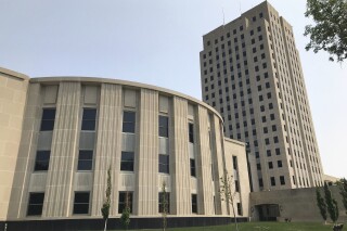 FILE - The North Dakota House chamber and Capitol tower stand in Bismarck, N.D., June 14, 2023. The North Dakota Supreme Court on Wednesday, June 28, will hear oral arguments in the state Public Employees Retirement System Board's lawsuit challenging legislative appointments to the panel. (AP Photo/Jack Dura, File)