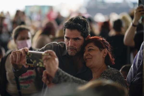 FILE - Presidential hopeful Eduardo Verastegui poses for a selfie with a supporter during a rally to collect signatures to enable him to run as an independent candidate, in San Bartolo del Valle, Mexico, Nov. 10, 2023. Thousands of people supported the presidential aspirations of Verástegui, a right-wing activist and film producer who — although his campaign faltered — echoed the voices of conservatives rejecting abortion and LGBTQ+ rights. (AP Photo/Eduardo Verdugo, File)