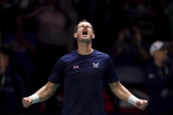 Great Britain's Andy Murray celebrates beating Switzerland's Leandro Riedi during the Davis Cup group stage match at the AO Arena, in Manchester, England, Friday, Sept. 15, 2023. (Martin Rickett/PA via AP)