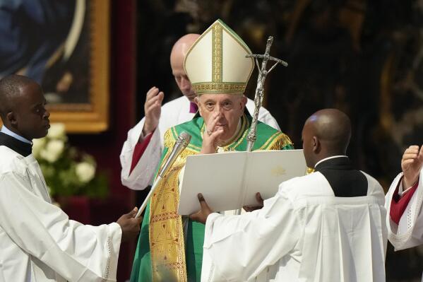 Pope Francis delivers his blessing at the end of a mass for the Congolese community he presided in St. Peter's Basilica, at the Vatican, Sunday, July 3, 2022. (AP Photo/Andrew Medichini)