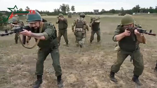 FILE - In this photo taken from video released by Belarusian Defense Ministry via VoenTV on Friday, July 14, 2023, Belarusian soldiers attend a training by mercenary fighters from Wagner private military company near Tsel village, about 90 kilometers (about 55 miles) southeast of Minsk, Belarus. Thousands of Russia-linked Wagner group mercenaries have arrived in Belarus since the group's short-lived rebellion, a military monitoring group said Monday. (Belarusian Defense Ministry via VoenTV via AP, File)