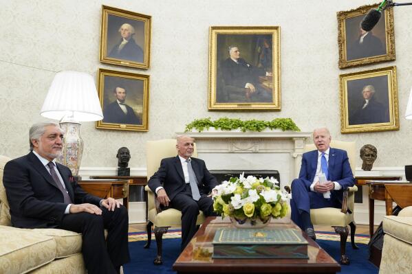 President Joe Biden, right, meets with Afghan President Ashraf Ghani, center, and Chairman of the High Council for National Reconciliation Abdullah Abdullah, left, in the Oval Office of the White House in Washington, Friday, June 25, 2021. (AP Photo/Susan Walsh)