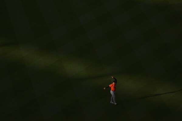 Houston Astros first base Christian Walker stretches before a baseball game against the Los Angeles Angels Saturday, June 21, 2025, in Anaheim, Calif. (AP Photo/Wally Skalij)