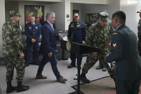 Colombia's President Ivan Duque arrives to speak to journalists before departing to attend the U.N. General Assembly from CATAM air base in Bogota, Colombia, Saturday, Sept. 21, 2019. (AP Photo/Ivan Valencia)