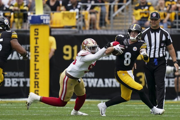 San Francisco 49ers defensive end Drake Jackson, left, sacks Pittsburgh Steelers quarterback Kenny Pickett (8) during the first half of an NFL football game Sunday, Sept. 10, 2023, in Pittsburgh. (AP Photo/Matt Freed)
