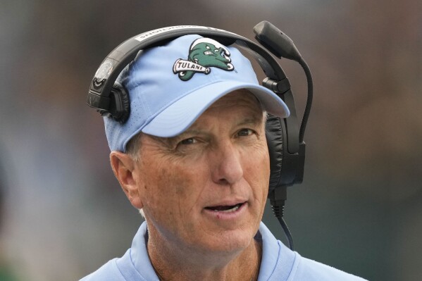 Tulane head coach Willie Fritz walks on the sideline in the first half of an NCAA college football game against UTSA in New Orleans, Friday, Nov. 24, 2023. (AP Photo/Gerald Herbert)