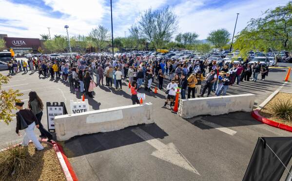 Voters wait in line to cast their ballots on election day Tuesday, Nov. 5, 2024, in Las Vegas. (L.E. Baskow/Las Vegas Review-Journal via AP)