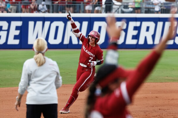 Oklahoma's Kasidi Pickering (7) celebrates a home run against Texas during the second inning of Game 2 of the NCAA Women's College World Series softball championship series Thursday, June 6, 2024, in Oklahoma City. (AP Photo/Alonzo Adams, File)