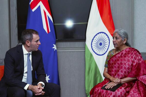 In this handout photo released by Indian Finance Ministry, Australia's Treasurer Jim Chalmers, left, meets with Indian Finance Minister Nirmala Sitharaman on the sidelines of G-20 financial conclave on the outskirts of Bengaluru, India, Saturday, Feb. 25, 2023. (Indian Finance Ministry via AP)