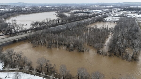 Portions of Basil Griffin Park in Bowling Green, Ky., Sunday February 16, 2025, sit after strong precipitation beginning early Saturday morning brought almost five inches of rain in the county of Warren and after the snow has covered the region. (Jack Dobbs / Daily News via AP)