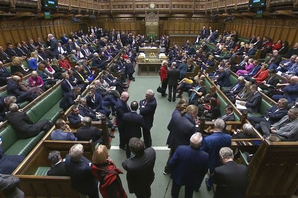 MP's gather in the House of Commons ahead of the second reading vote, in London, Tuesday, Dec. 12 2023. U.K. Prime Minister Rishi Sunak is trying to cajole recalcitrant lawmakers into supporting his signature immigration policy in a key vote in Parliament. Defeat would leave his authority shredded and his government teetering. (UK Parliament via AP)