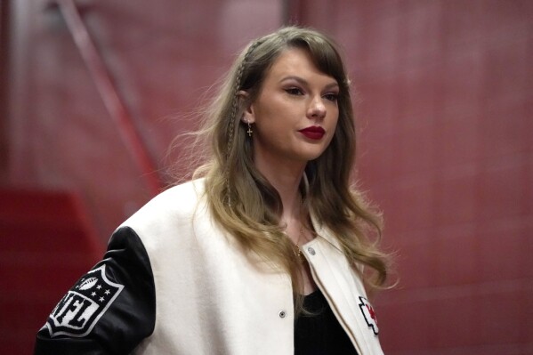 FILE - Taylor Swift enters Arrowhead Stadium before the start of an NFL football game between the Kansas City Chiefs and the Cincinnati Bengals, Dec. 31, 2023, in Kansas City, Mo. David Crowe, a Seattle man who police say has been stalking and harassing Swift, was ordered held without bail Thursday, Jan. 25, 2024, after he was arrested three times in recent days in front of the pop star's home in Manhattan's Tribeca neighborhood. (AP Photo/Ed Zurga, File)