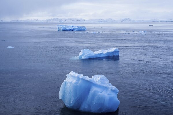 Pieces of ice float on the sea in Nuuk, Greenland, Tuesday, March 4, 2025. (AP Photo/Evgeniy Maloletka)