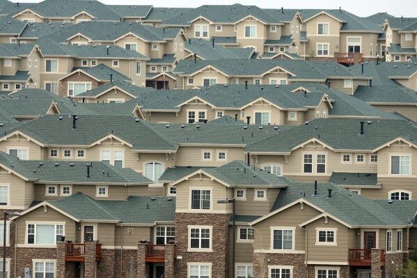 FILE - The roofs of houses stack up on a hillside in a development in the east Denver suburb of Aurora, Colo., Thursday, May 4, 2006. In the election, Tuesday, Nov. 7, 2023, voters will determine the fate of Proposition HH, a measure aimed at easing the immediate property tax increase facing the state's landowners while lifting Colorado's revenue cap for the foreseeable future. (AP Photo/David Zalubowski, File)