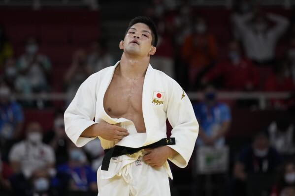 Shohei Ono of Japan reacts after winning the men's -73kg judo final match against Lasha Shavdatuashvili of Georgia, at the 2020 Summer Olympics in Tokyo, Japan, Monday, July 26, 2021. (AP Photo/Vincent Thian)