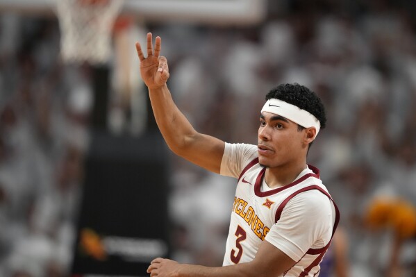 Iowa State guard Tamin Lipsey (3) celebrates a 3-point basket during the first half of an NCAA college basketball game against Kansas, Saturday, Jan. 27, 2024, in Ames, Iowa. (AP Photo/Matthew Putney)