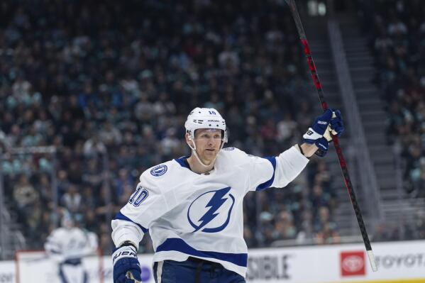 Tampa Bay Lightning forward Corey Perry celebrates after scoring a goal during the first period of an NHL hockey game against the Seattle Kraken, Monday, Jan. 16, 2023, in Seattle. (AP Photo/Stephen Brashear)