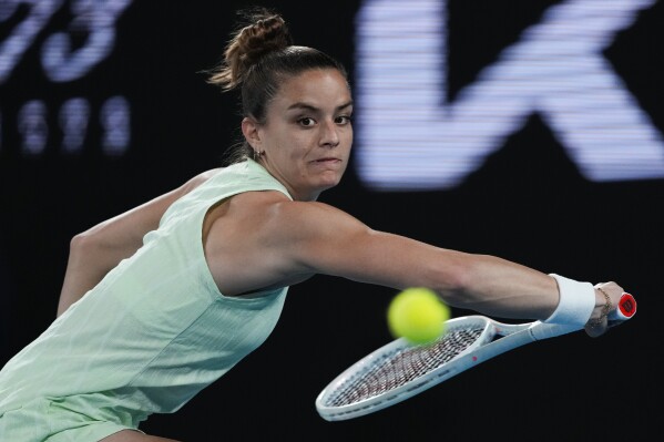 Maria Sakkari of Greece plays a backhand return to Elina Avanesyan of Russia during their second round match at the Australian Open tennis championships at Melbourne Park, Melbourne, Australia, Wednesday, Jan. 17, 2024. (AP Photo/Andy Wong)