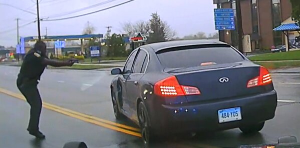 
              This still image from police dash camera video released Friday, May 3, 2019, by the Hartford State's Attorney shows Police Officer Layau Eulizier, Jr., pointing his weapon at a car being driven at him by Anthony Jose Vega Cruz during an attempted traffic stop April 20 in Wethersfield, Conn. Eulizier shot through the windshield, striking Vega Cruz, of Wethersfield, who died two days later at a hospital. (Hartford State's Attorney via AP)
            