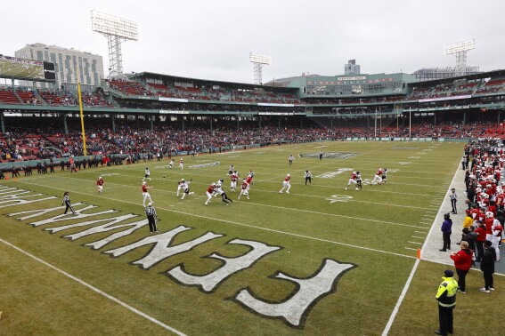 FILE - Louisville meets Cincinnati during the first quarter of the Fenway Bowl NCAA college football game at Fenway Park Saturday, Dec. 17, 2022, in Boston. SMU gets an Atlantic Coast Conference prequel when it plays Boston College in the Fenway Bowl on Thursday, Dec. 28, 2023. (AP Photo/Winslow Townson, File)