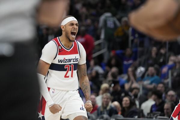 Washington Wizards center Daniel Gafford (21) reacts after his game winning basket during the second half of an NBA basketball game against the Detroit Pistons, Tuesday, March 7, 2023, in Detroit. (AP Photo/Carlos Osorio)
