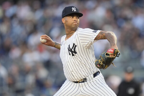 Yankees starter Luis Gil exits in 4th inning against Guardians with lower  back tightness | AP News
